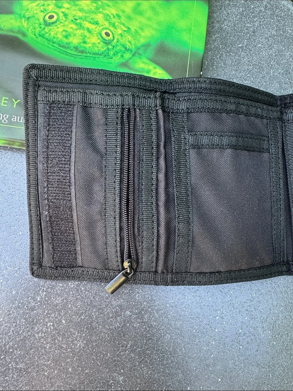 NWOT NEFF black background with tropical theme trifold wallet. Zipper pocket.